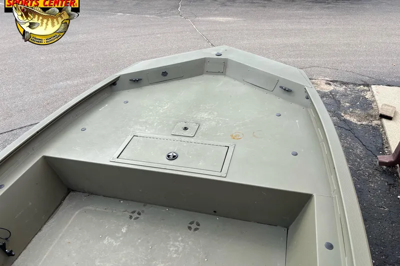 Slide: The Image of 2023 Tracker Grizzly 1860 CC boat deck, featuring storage compartments and a rugged design. - 5