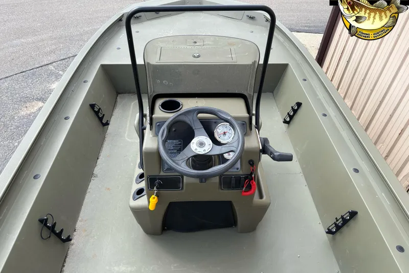 Slide: The Image of 2023 Tracker Grizzly 1860 CC boat console with steering wheel and gauges. - 8
