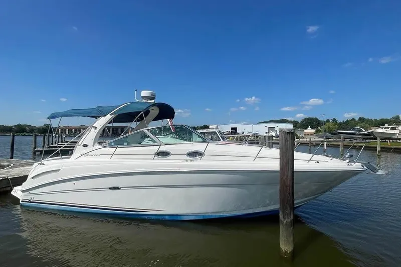 The Image of 2003 Sea Ray 300 Sundancer boat docked on a sunny day. - 0
