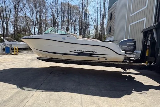 Slide: The Image of 2009 Hydra-Sports 2200 DC boat with Yamaha engine on a lift outdoors. - 4