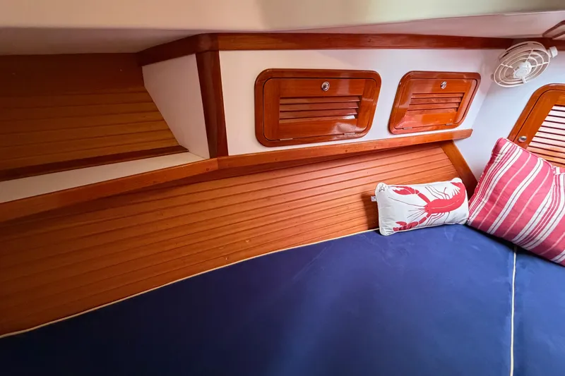 Slide: The Image of Cozy cabin interior of 2001 Bluestar BlueStar 29.9 with wooden accents and nautical pillows. - 33