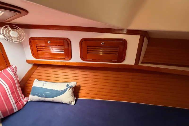 Slide: The Image of Cozy cabin interior of 2001 Bluestar BlueStar 29.9 with wooden accents and nautical pillows. - 32