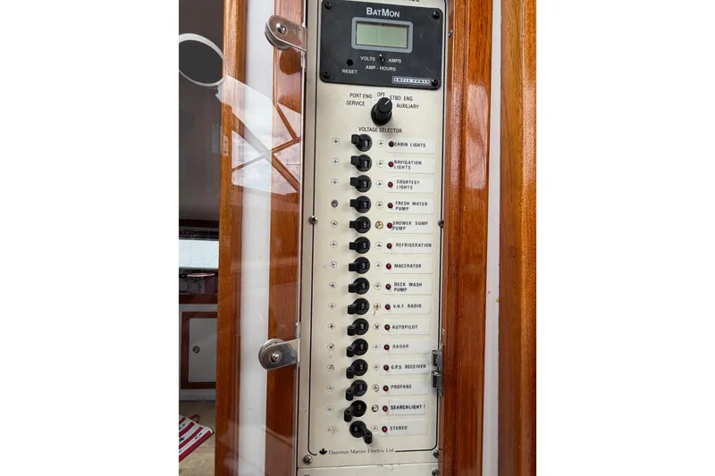 Slide: The Image of Control panel of a 2001 Bluestar BlueStar 29.9 boat with various switches and indicators. - 24