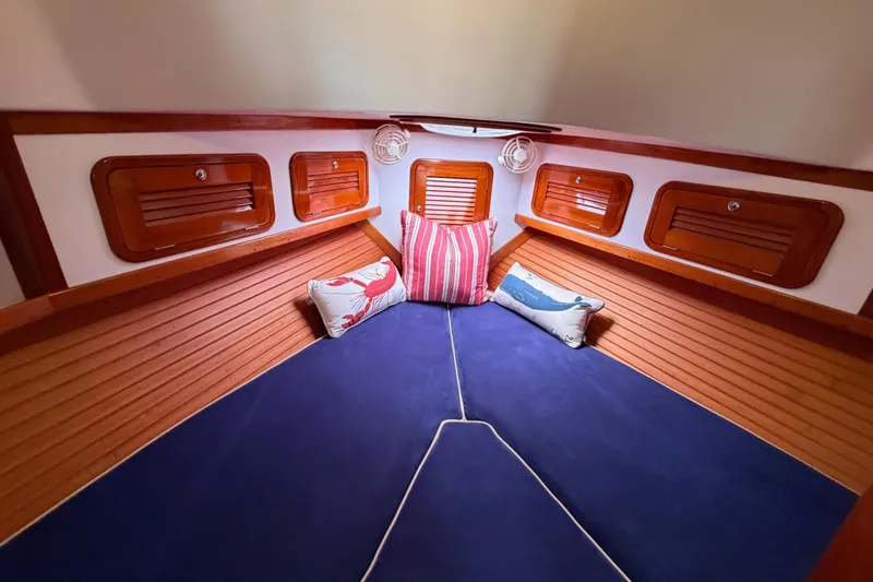 Slide: The Image of Cozy cabin interior of 2001 Bluestar BlueStar 29.9 with nautical-themed cushions. - 30