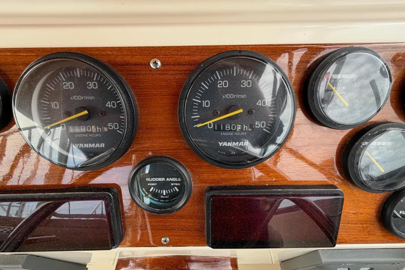 Slide: The Image of Dashboard of a 2001 Bluestar BlueStar 29.9 boat with Yanmar gauges. - 13
