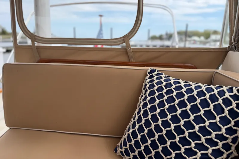 Slide: The Image of Tan boat seating with a navy nautical pillow on a 2001 Bluestar BlueStar 29.9. - 8