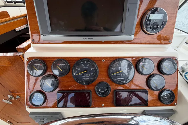 Slide: The Image of Control panel of a 2001 Bluestar BlueStar 29.9 boat with gauges and Garmin display. - 15