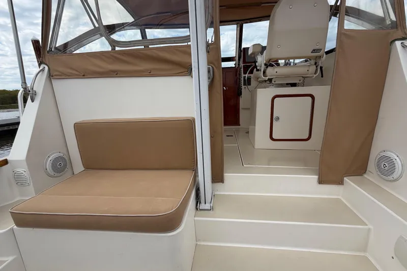 Slide: The Image of 2001 Bluestar BlueStar 29.9 boat interior with beige seating and helm station. - 4