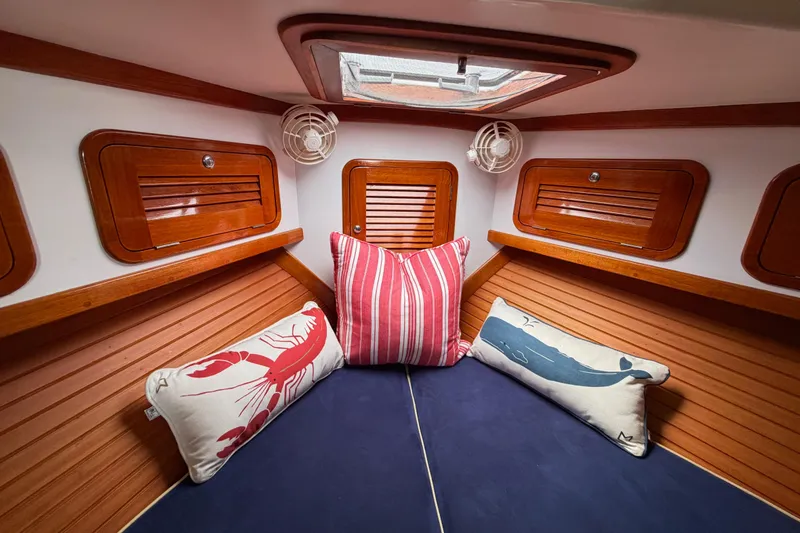 Slide: The Image of Cozy cabin interior of 2001 Bluestar BlueStar 29.9 with nautical-themed pillows. - 31
