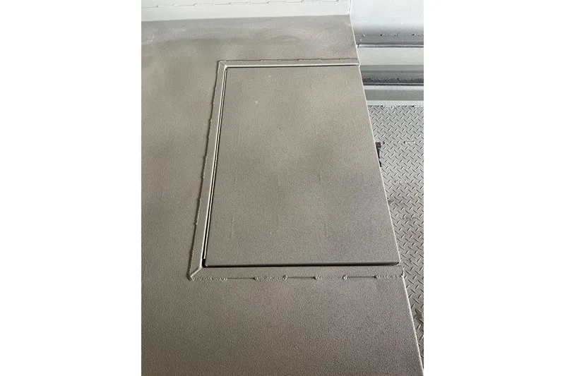 Slide: The Image of Deck hatch on 2026 Reaper Boats 553 Timber Reaper, featuring textured metal surface. - 10