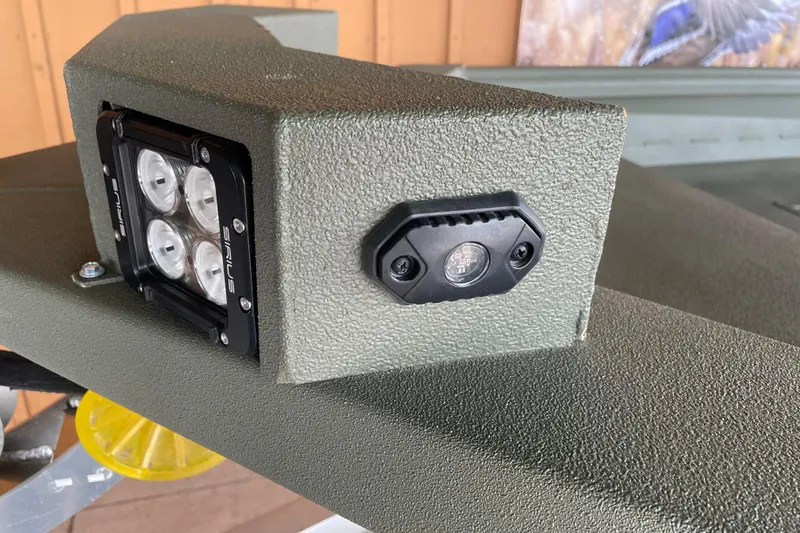 Slide: The Image of Close-up of 2026 Reaper Boats 553 Timber Reaper's LED light and sensor on textured surface. - 4