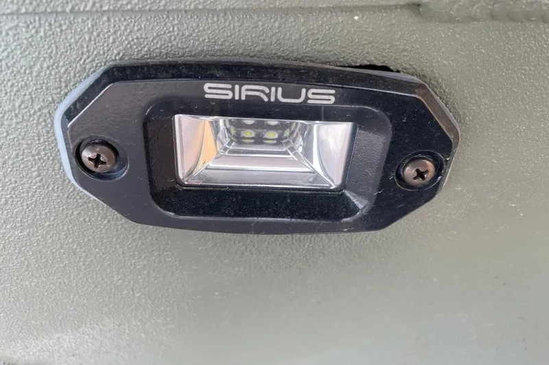 Slide: The Image of Close-up of Sirius light fixture on 2026 Reaper Boats 553 Timber Reaper. - 6