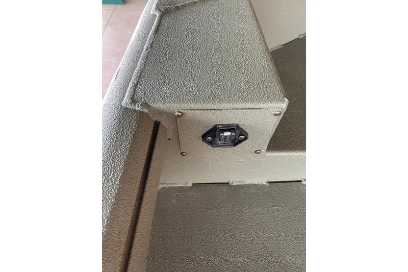 Slide: The Image of 2026 Reaper Boats 553 Timber Reaper interior detail with textured surface and mounted component. - 9