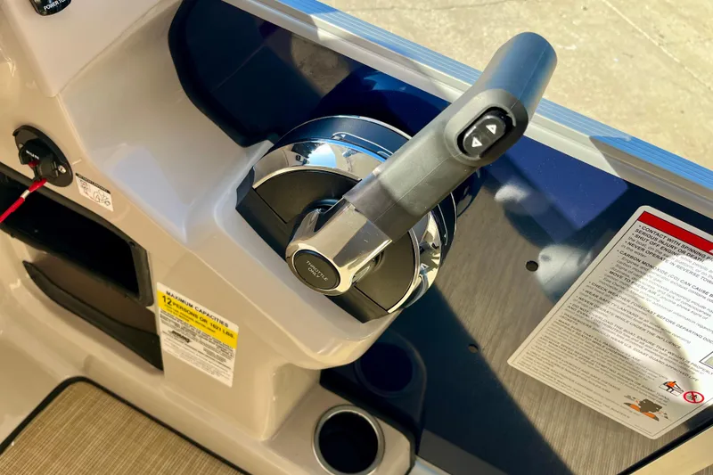 Slide: The Image of Close-up of throttle control on a 2026 Harris Cruiser 210. - 11