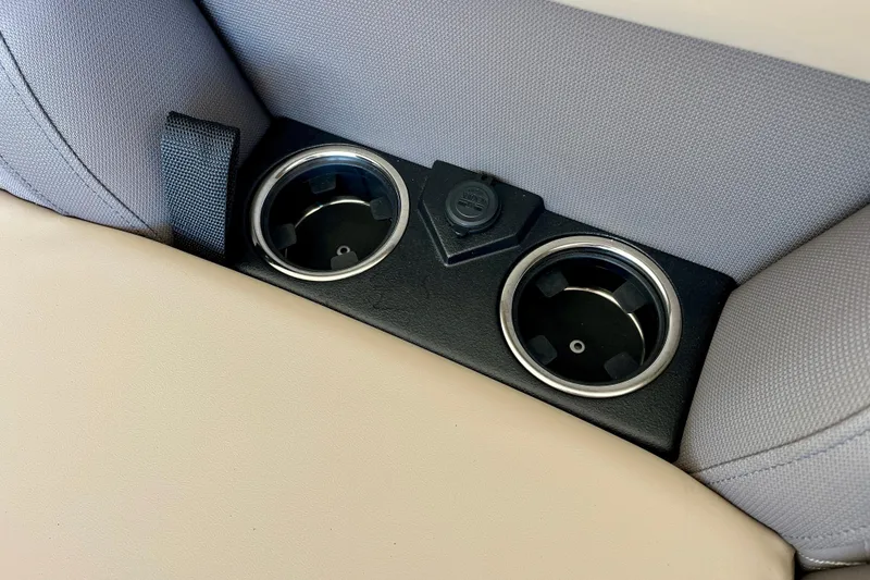 Slide: The Image of Harris Cruiser 210 2026 cup holders and power outlet detail view. - 13