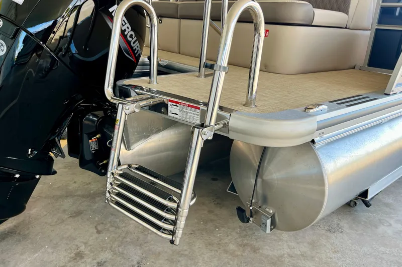 Slide: The Image of 2026 Harris Cruiser 210 with stainless steel ladder and Mercury engine. - 16