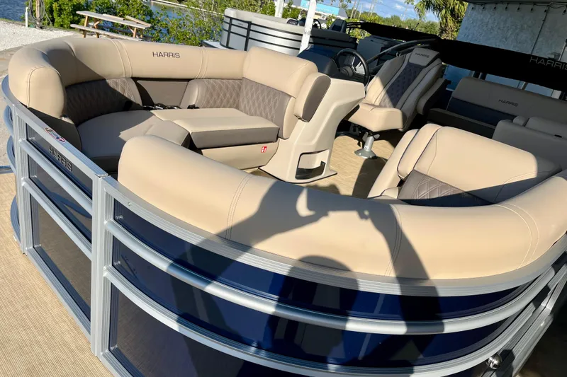 Slide: The Image of 2026 Harris Cruiser 210 pontoon boat with luxurious seating. - 3