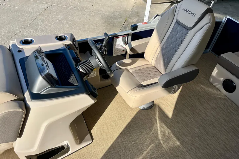 Slide: The Image of Interior of 2026 Harris Cruiser 210 boat with luxurious captain's chair. - 4