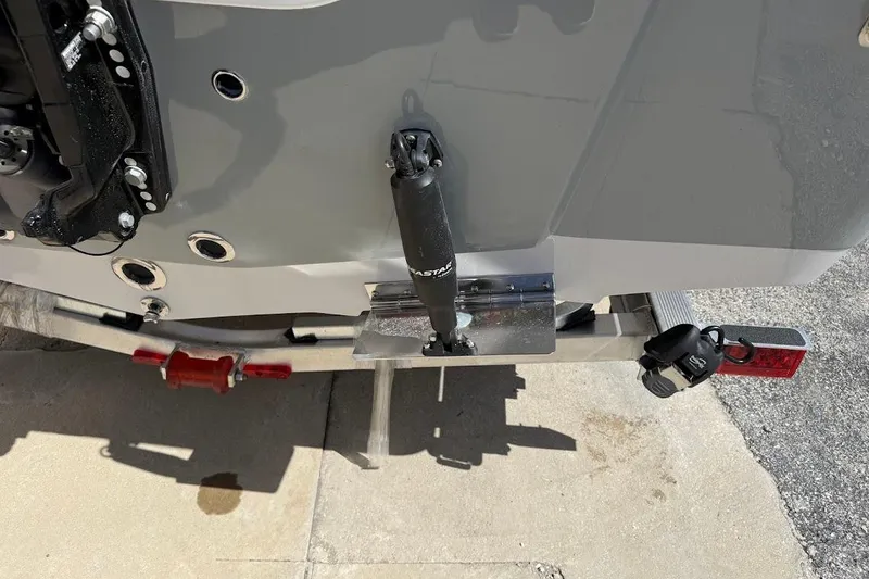 Slide: The Image of Rear view of a 2026 Sea Pro 230 Bay boat on a trailer, showing trim tabs and motor mount. - 13
