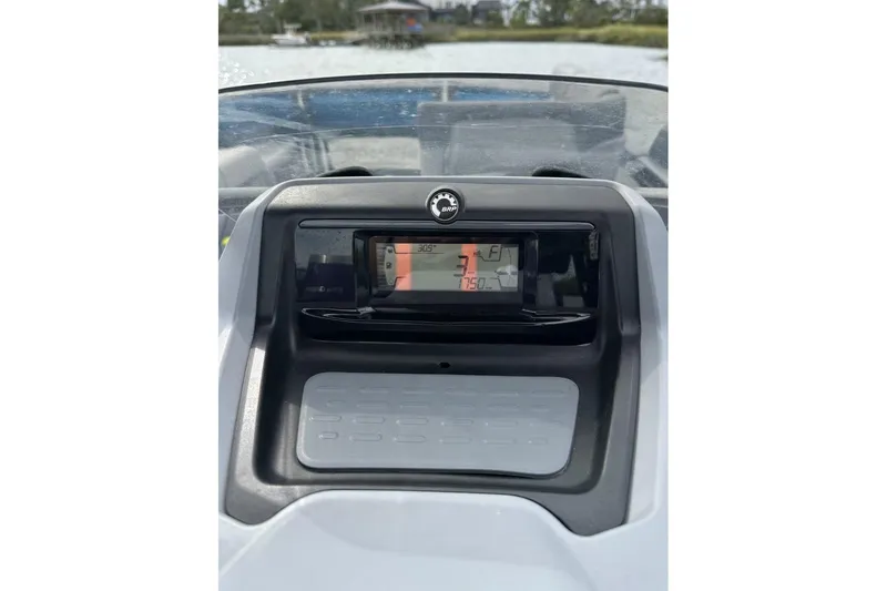 Slide: The Image of 2023 Bombardier Sea Doo dashboard display on water, showing speed and fuel indicators. - 10