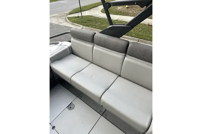 Slide: The Image of 2023 Bombardier Sea Doo interior with gray cushioned seating and sleek design. - 12