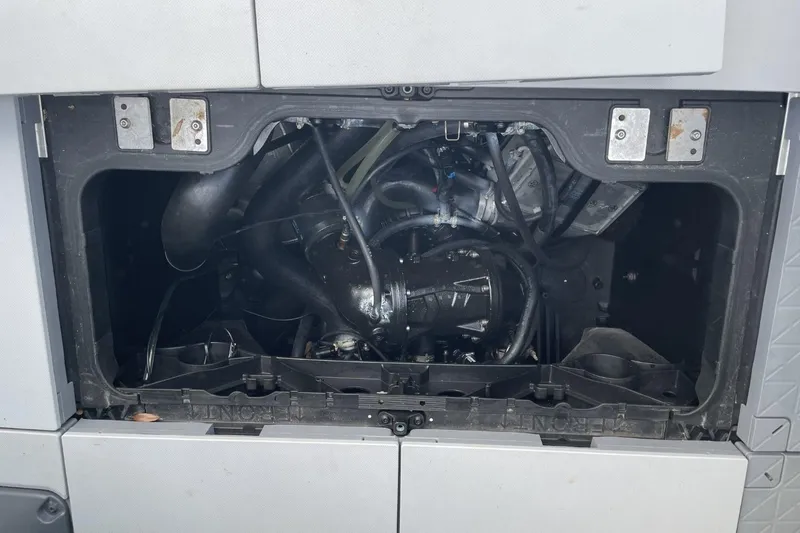 Slide: The Image of Engine compartment of a 2023 Bombardier Sea Doo, showcasing internal components and wiring. - 19