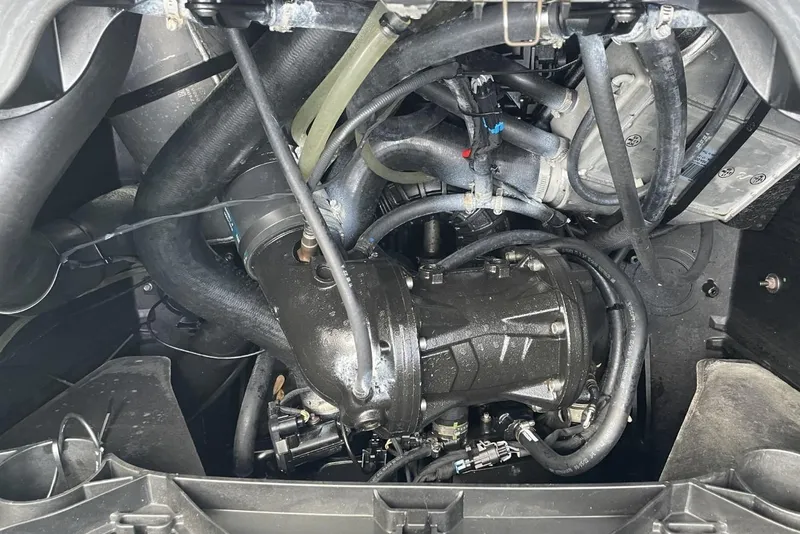Slide: The Image of Engine compartment of a 2023 Bombardier Sea Doo, showcasing intricate mechanical components. - 20