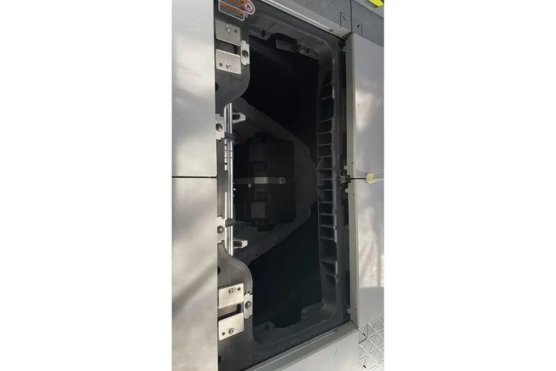 Slide: The Image of Open storage compartment of 2023 Bombardier Sea Doo watercraft. - 21