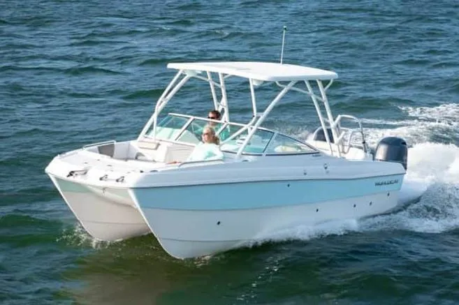 Slide: The Image of 2026 World Cat 230 SD boat with dual Yamaha outboard engines, rear view. - 2