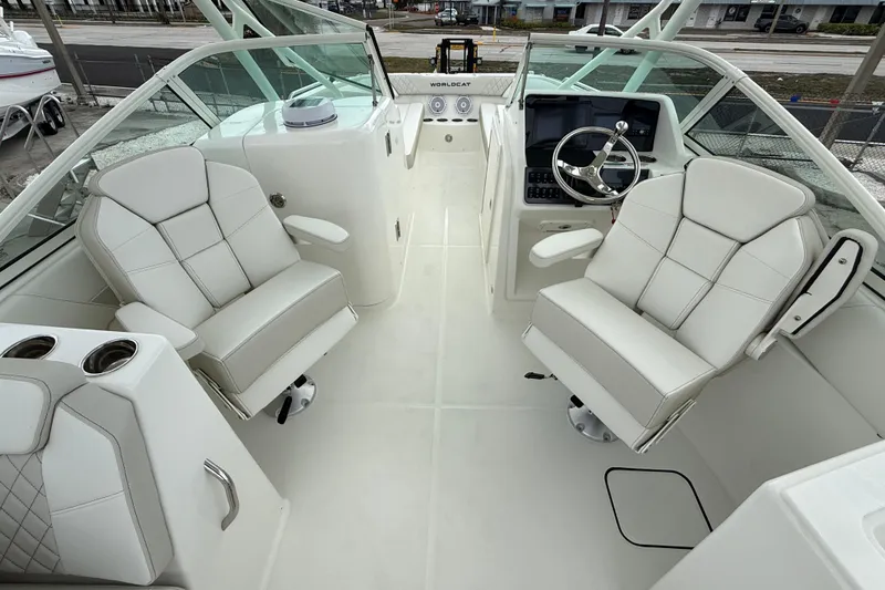 Slide: The Image of Interior of 2026 World Cat 230 SD boat with luxurious seating and modern dashboard. - 22