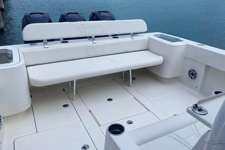 Slide: The Image of 2020 SeaVee 370Z boat with spacious seating and triple outboard engines. - 14