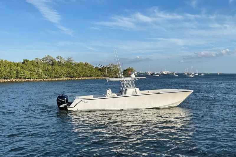 Slide: The Image of 2020 SeaVee 370Z boat on calm water with clear blue sky. - 5
