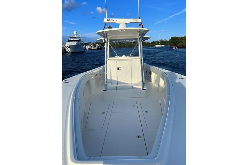 Slide: The Image of 2020 SeaVee 370Z boat on water, featuring spacious deck and Garmin equipment. - 9