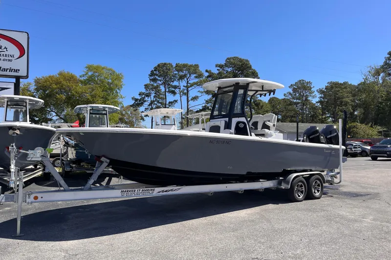Slide: The Image of 2024 Tidewater 2700 Carolina Bay boat on trailer at dealership. - 1