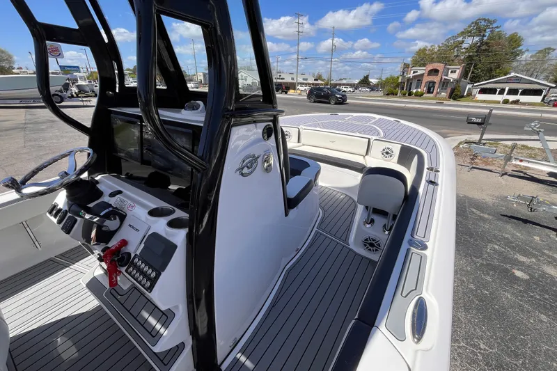 Slide: The Image of 2024 Tidewater 2700 Carolina Bay boat interior with modern console and seating. - 11