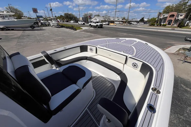 Slide: The Image of 2024 Tidewater 2700 Carolina Bay boat interior with seating and deck view. - 12