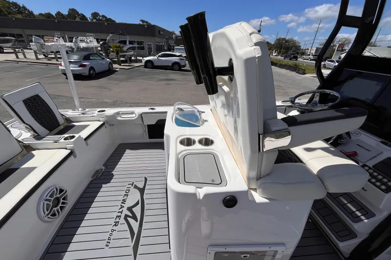 Slide: The Image of 2024 Tidewater 2700 Carolina Bay boat interior with seating and control panel. - 7