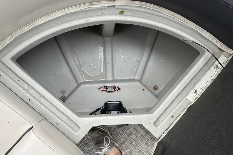 Slide: The Image of Storage compartment of 2023 Harris Cruiser 230 boat, featuring a clean, spacious interior. - 33
