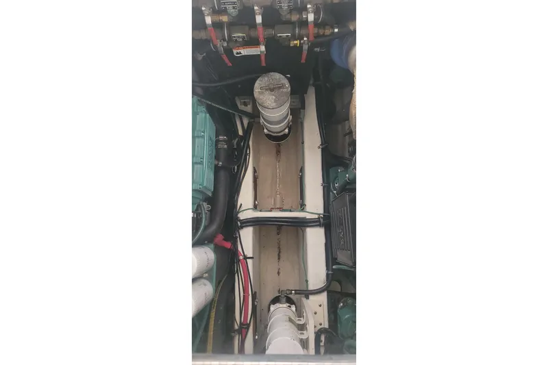 Slide: The Image of Engine compartment of a 2006 Wellcraft 330 Coastal boat, showcasing mechanical components. - 22