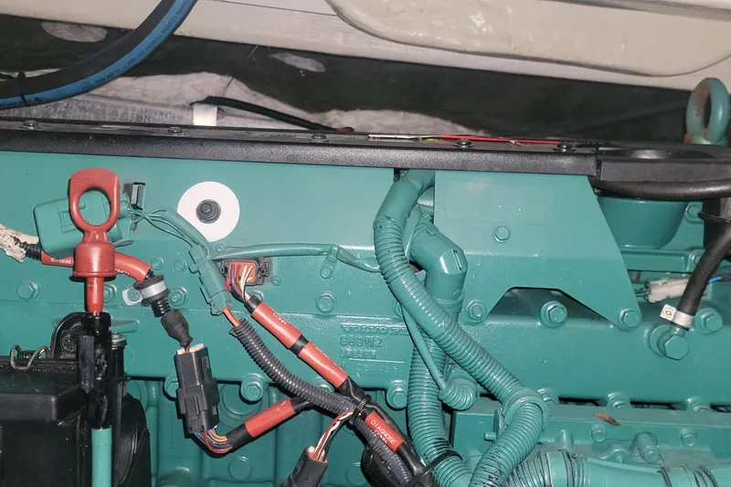 Slide: The Image of Engine compartment of a 2006 Wellcraft 330 Coastal boat, featuring wiring and components. - 25