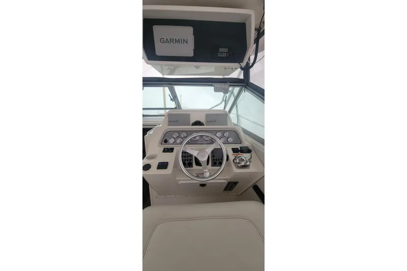 Slide: The Image of Helm of 2006 Wellcraft 330 Coastal boat with Garmin navigation system. - 4