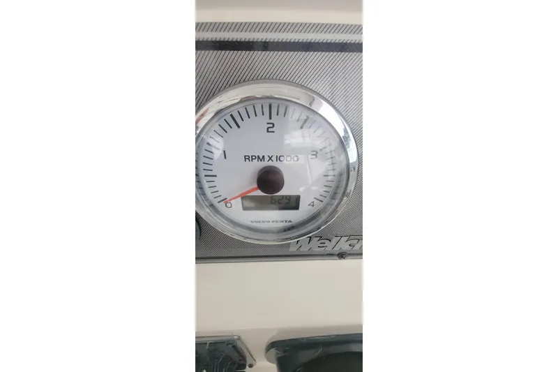 Slide: The Image of Tachometer of 2006 Wellcraft 330 Coastal boat, displaying RPM and engine hours. - 6