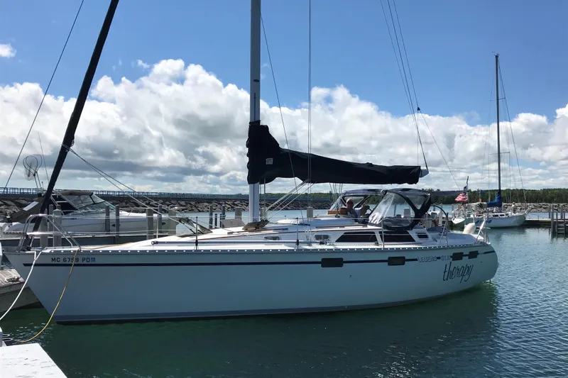 The Image of Sailboat docked in marina, 1991 Hunter Legend 37.5, under partly cloudy sky. - 0