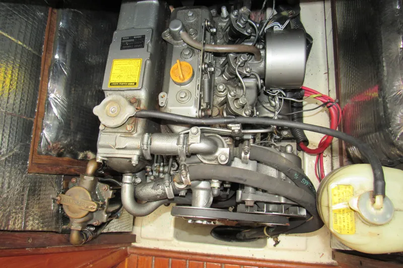 Slide: The Image of Engine compartment of a 1991 Marlow-Hunter 37.5 sailboat, showcasing mechanical components. - 17