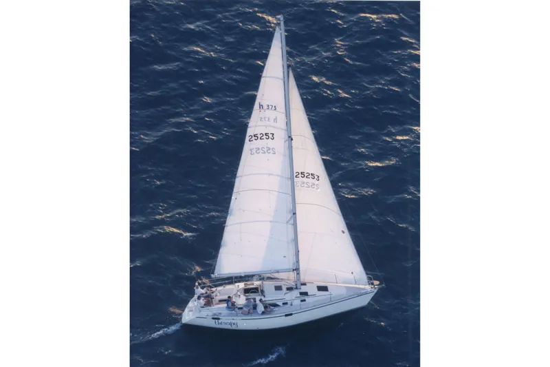 Slide: The Image of Aerial view of 1991 Hunter Legend 37.5 sailboat navigating ocean waters. - 2