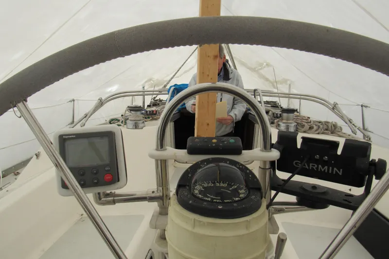 Slide: The Image of Cockpit view of a 1991 Marlow-Hunter 37.5 sailboat with navigation instruments. - 4