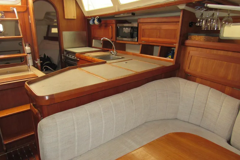 Slide: The Image of Interior of 1991 Marlow-Hunter 37.5 sailboat with kitchen and seating area. - 7