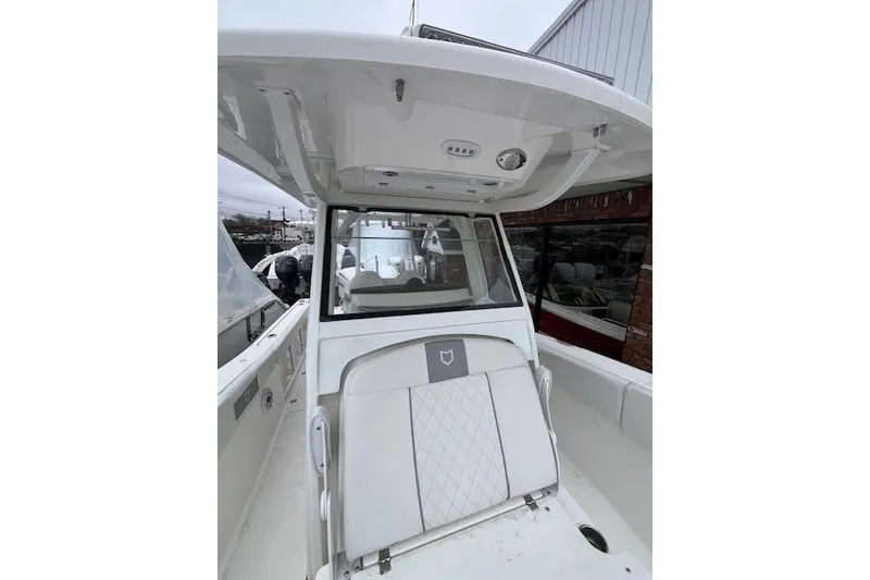 Slide: The Image of 2026 Sea Fox 288 Commander boat interior with seating and overhead console. - 10