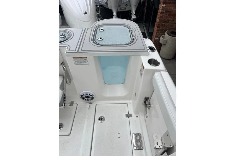 Slide: The Image of 2026 Sea Fox 288 Commander boat interior with storage compartments and cup holders. - 14