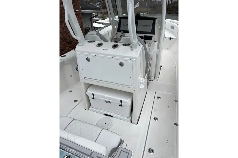 Slide: The Image of 2026 Sea Fox 288 Commander boat interior with Garmin displays and Yeti cooler. - 5